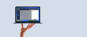 Hand-Held-MacBook-Neo-Free-PSD-Mockup-1